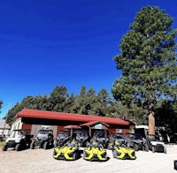 a group of atvs parked in front of a building