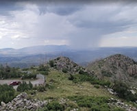 a car is parked on top of a mountain